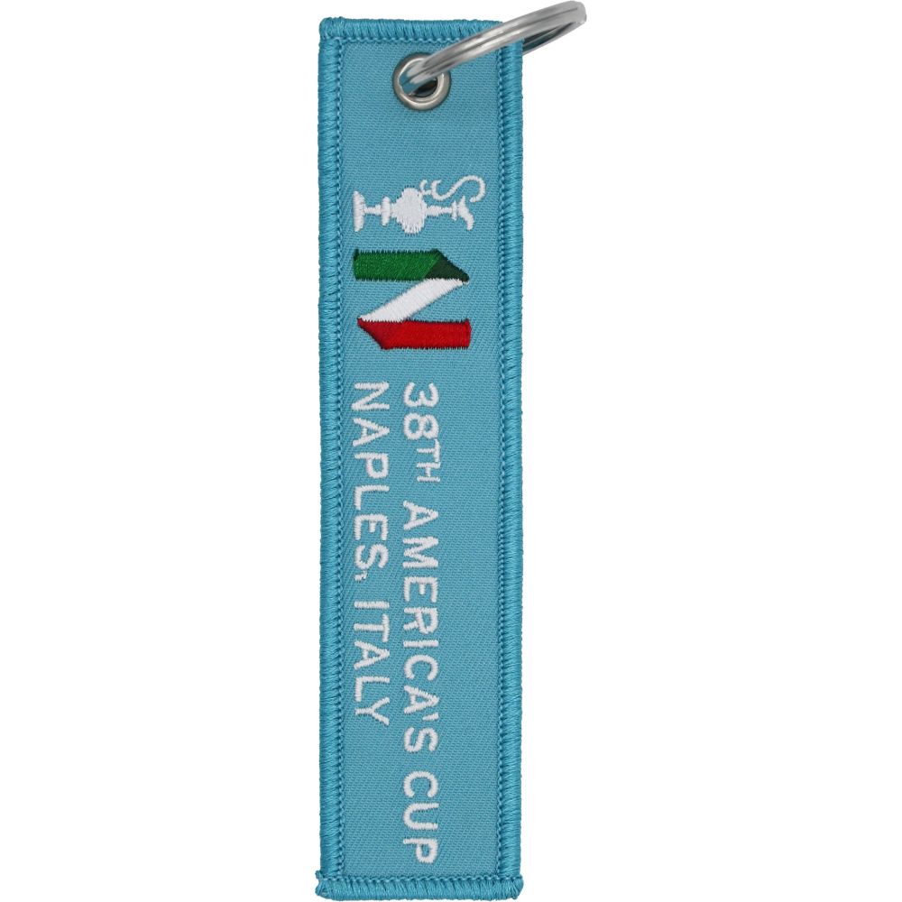 PORTACHIAVI AMERICA'S CUP 38 STOFFA CELESTE CON LOGHI E SCRITTA